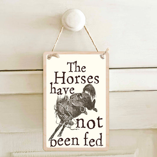 The horses have been fed / The horses have not been fed - Double-sided wooden mini sign.
Made from certified sustainable wood and printed on both sides with a fun, practical message and retro illustration.
15 × 10 cm sustainable wood, natural twine.
Light and durable, eco-friendly, ready to hang.
Made in Suffolk. 