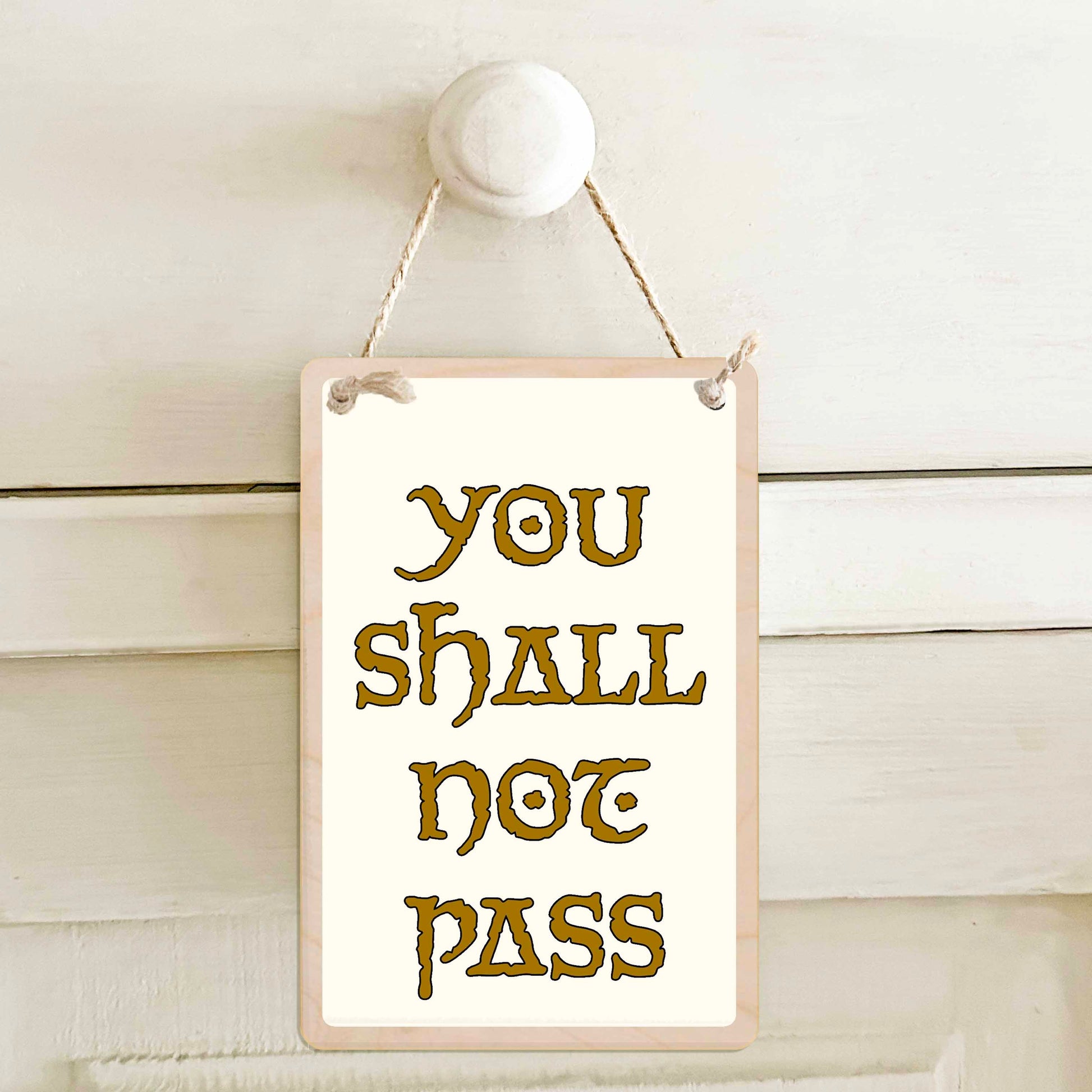 You shall not pass - Wooden mini sign. Gift for teenagers or anyone who like their privacy.

15 × 10 cm sustainable wood, natural twine.

Light and durable, eco-friendly, ready to hang.

Made in Suffolk.
