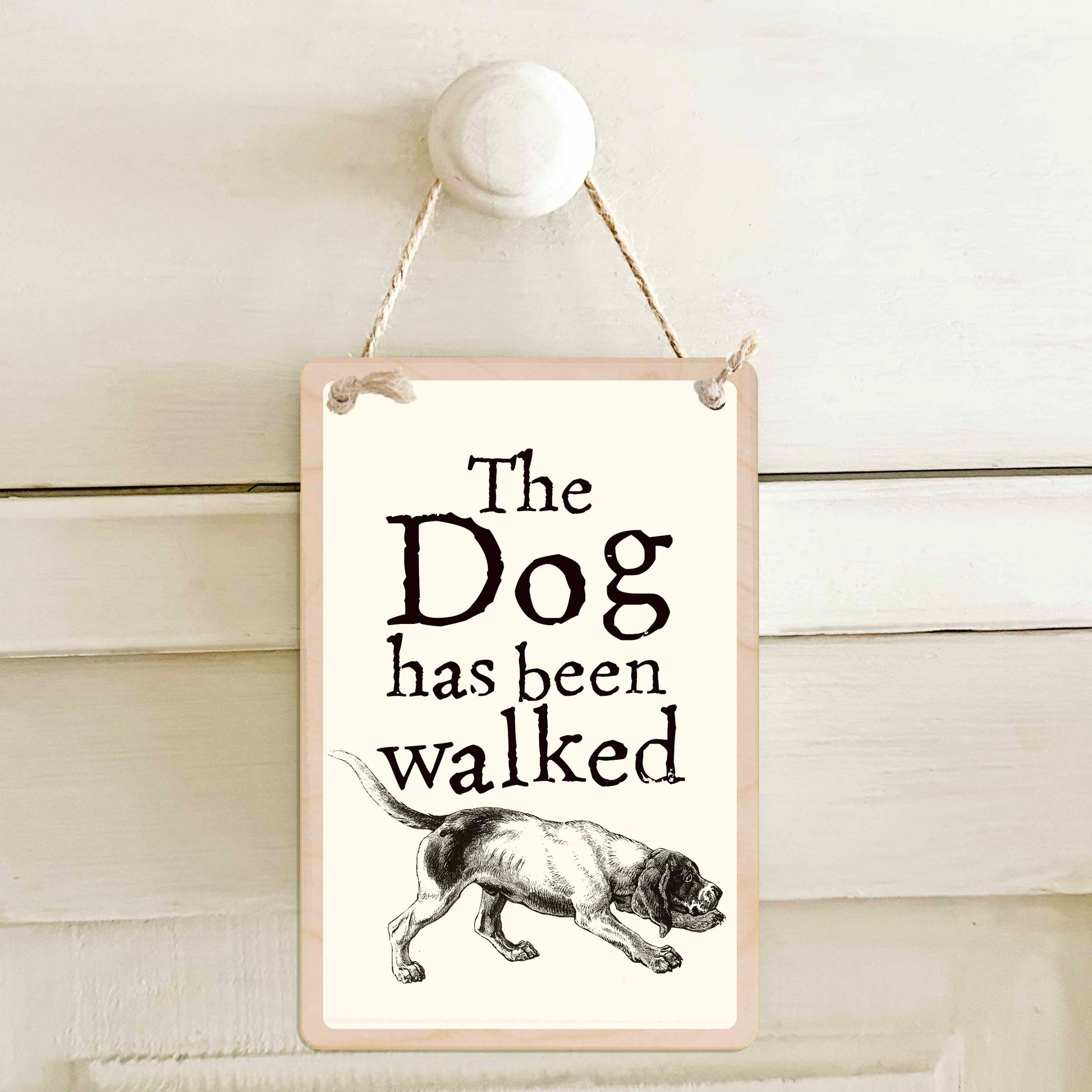 The Dog has been walked / The Dog has not been walked - Double-sided wooden mini sign.

Made from certified sustainable wood and printed on both sides with a fun, practical message and retro illustration.

15 × 10 cm sustainable wood, natural twine.

Light and durable, eco-friendly, ready to hang.

Made in Suffolk.
