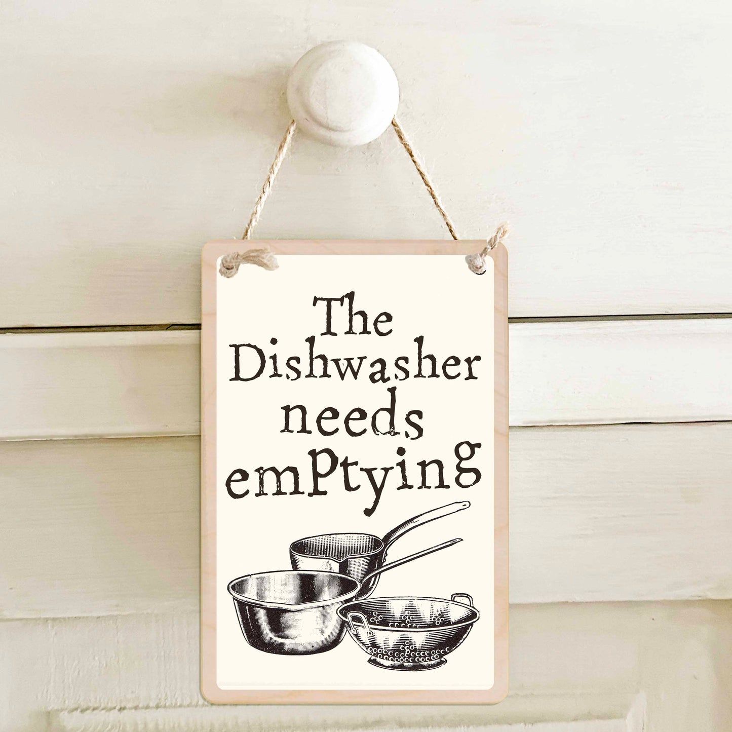 The dishwasher needs emptying / The dishwasher needs loading - Double-sided wooden mini sign.

Made from certified sustainable wood and printed on both sides with a fun, practical message and retro illustration.

15 × 10 cm sustainable wood, natural twine.
Light and durable, eco-friendly, ready to hang.

Made in Suffolk.