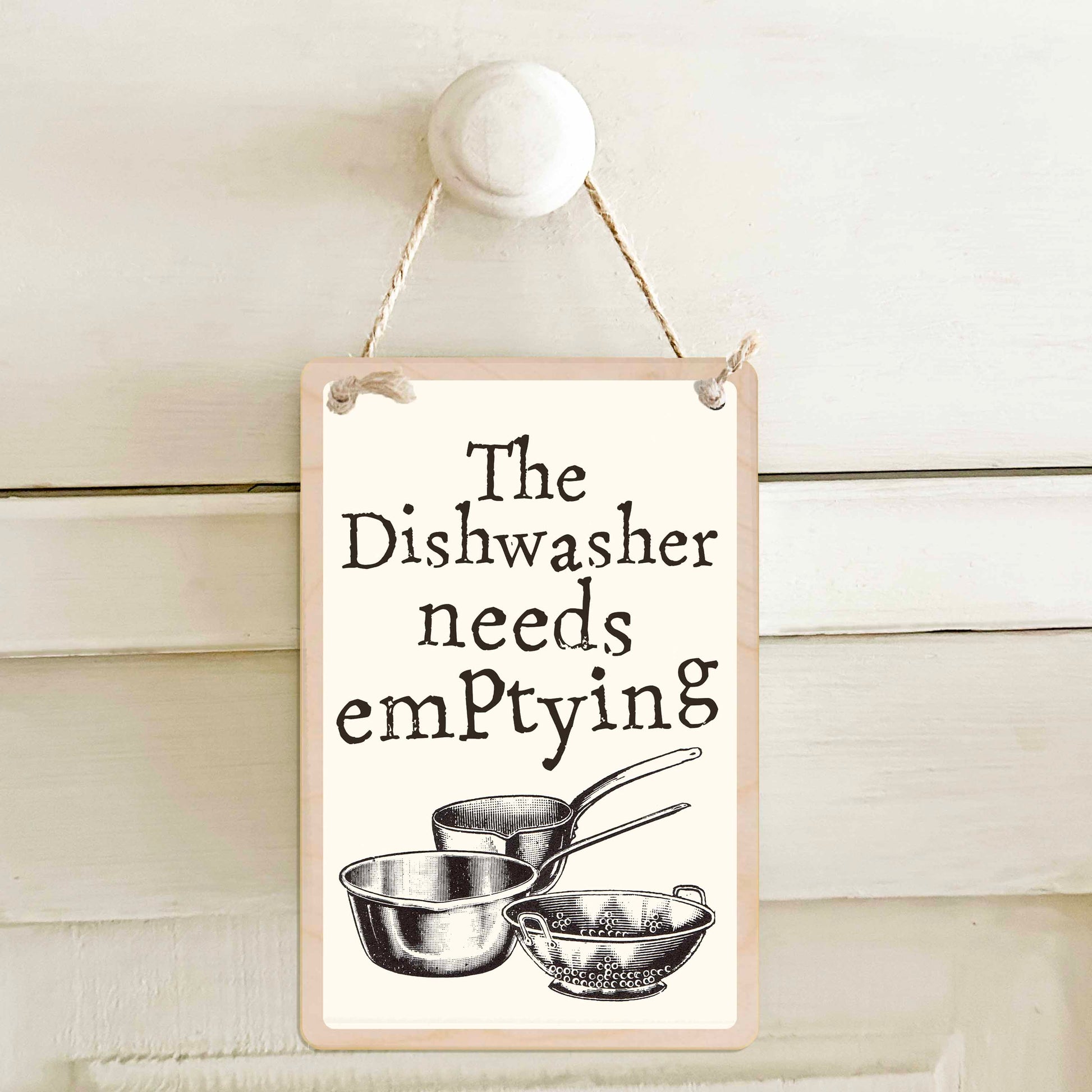 The dishwasher needs emptying / The dishwasher needs loading - Double-sided wooden mini sign.

Made from certified sustainable wood and printed on both sides with a fun, practical message and retro illustration.

15 × 10 cm sustainable wood, natural twine.
Light and durable, eco-friendly, ready to hang.

Made in Suffolk.