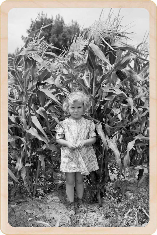 Vintage black and white photo of a young girl standing in a cornfield. Utah Farmer's Daughter&nbsp; - Original photography by Russel Lee - Eco-friendly Card - Wooden Postcard

Write on the back with any pen and post worldwide with a standard stamp. A smart, eco-friendly card and gift.